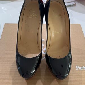 Black patten Christian Louboutin pumps